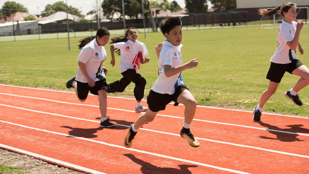 Students running on track