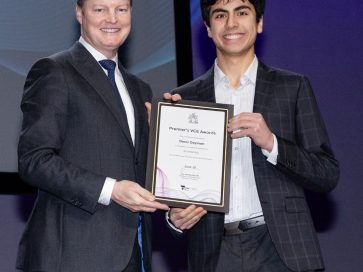 Deniz receiving his award at the VCE Premier's Award Presentation